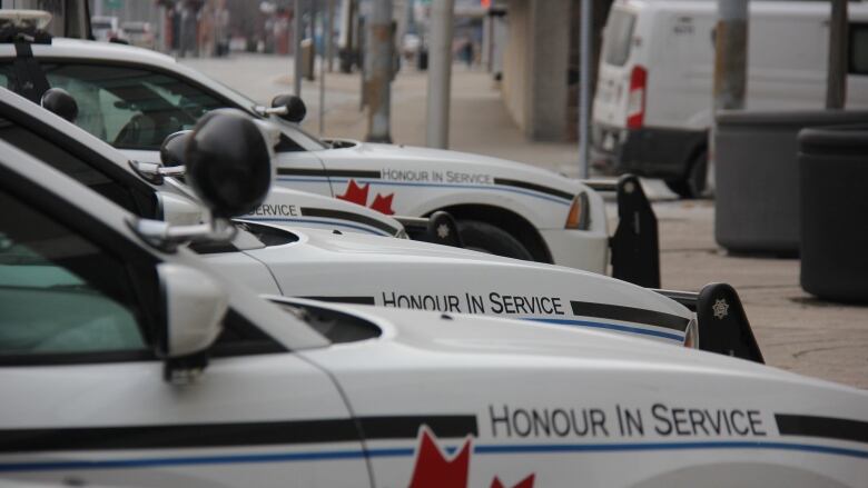 Side view of a row of Windsor Police cars.