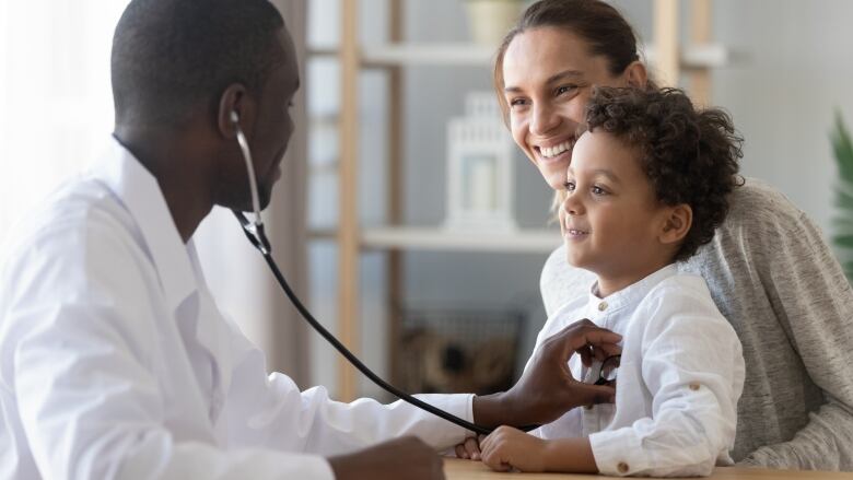 Family doctor administering care to child