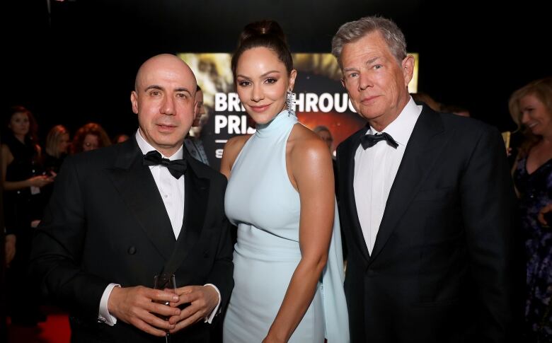 Yuri Milner, Katharine McPhee and David Foster are pictured left to right, in formal attire.