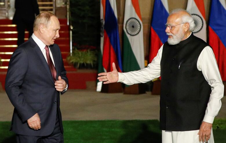 India's Prime Minister Narendra Modi welcomes Russia's President Vladimir Putin ahead of their meeting at Hyderabad House in New Delhi, India, in this file photo from Dec. 6, 2021. India has attempted to stay neutral when it comes to Russia's invasion of Ukraine. 