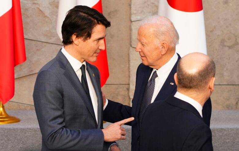 Prime Minister Justin Trudeau and U.S. President Joe Biden talk as they take part in a G7 family photo at NATO headquarters in Brussels, Belgium on Thursday, March 24, 2022. THE CANADIAN PRESS/Sean Kilpatrick