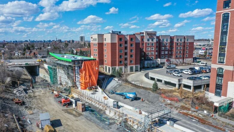 A construction site with what looks like a rail line in the middle.