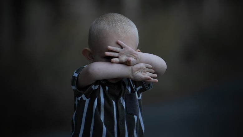 Child with arms up