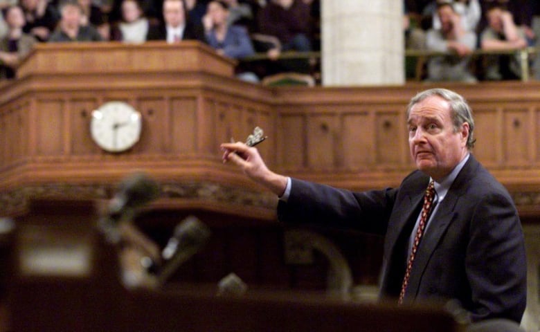 Finance Minister Paul Martin responds to questions during Question Period in the House of Commons in Ottawa Monday, March 15, 1999 as a full visitors gallery watches the proceedings.