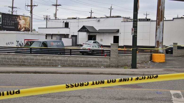 Police are seen outside the Gallery Vancouver club on May 23, 2022 after a deadly stabbing.