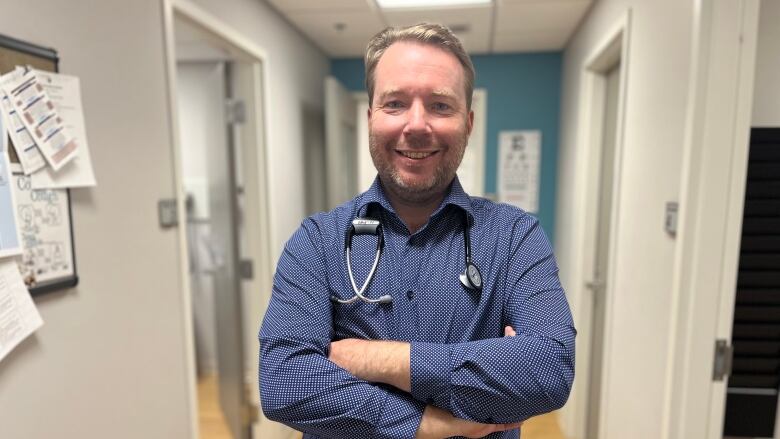 Dr. Padraig Casey in the hallway of his office.