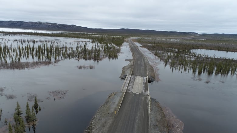 A road sits nearly underwater.