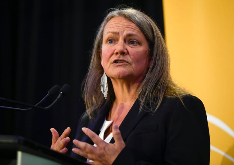 woman speaking at podium