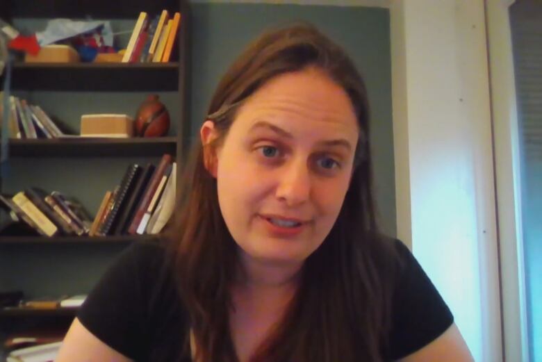 A woman conducts an interview via video conference.