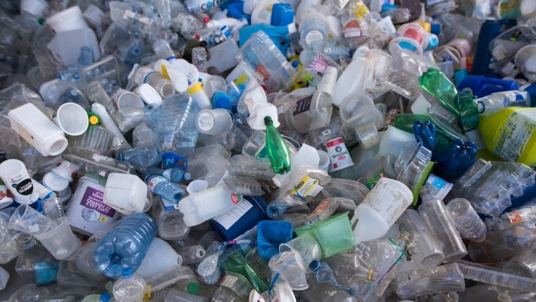 A closeup of empty plastic containers that are part of an art installation.