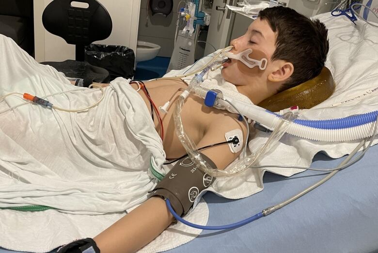 Boy in an ICU bed on life support.