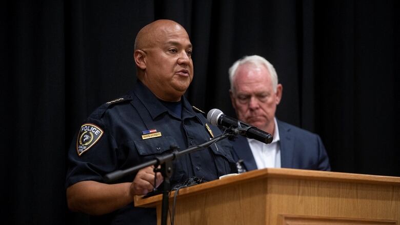 Uvalde schools police chief at a podium. 