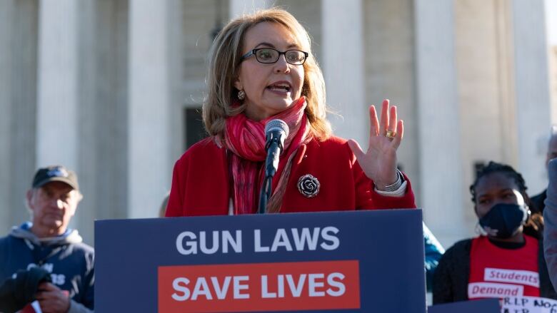 WOman speaking at podium