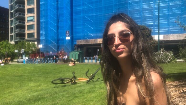 Vancouver construction worker Ivon Escobar, who rents a 'tiny' suite for $1,600, sits in the West End on Sunday, June 26, 2022. She worries if her rents rise again she won't be able to afford staying in the city.