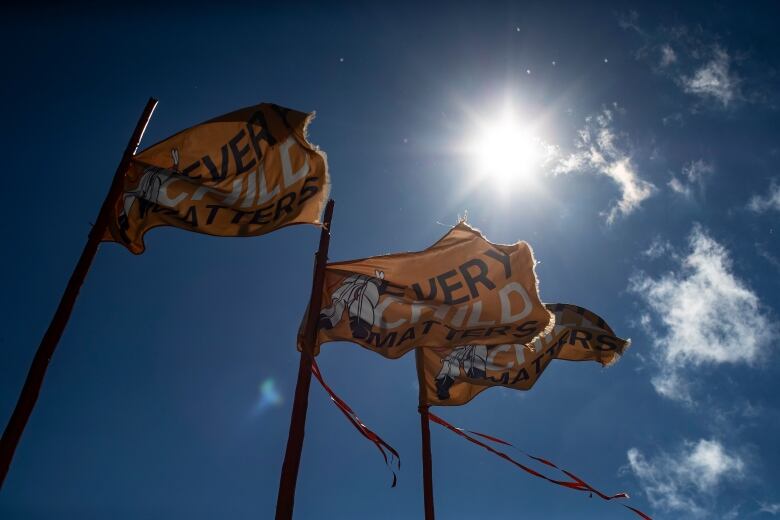 Orange flags that read 