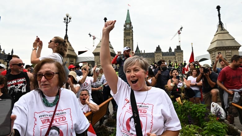 People protest outside Parliament Hill.