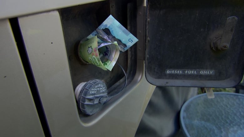 This photo shows two $20 and two $5 bills stuffed into the gas tank of a diesel RV.