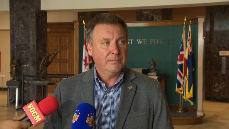 David Brazil speaks with reporters inside Confederation Building on Wednesday.