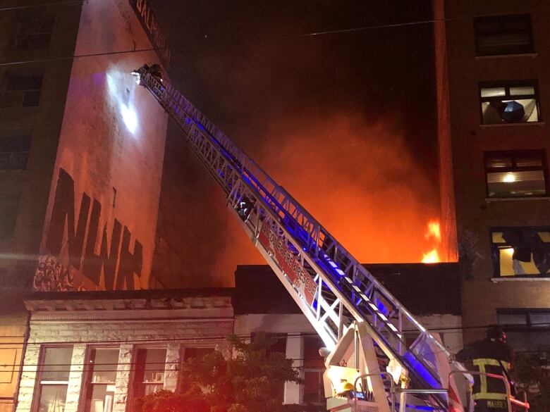 Vancouver Fire Rescue Services douse a fire in a Street Church at 175 East Hastings St. in the Downtown Eastside on Wednesday, July 6, 2022.