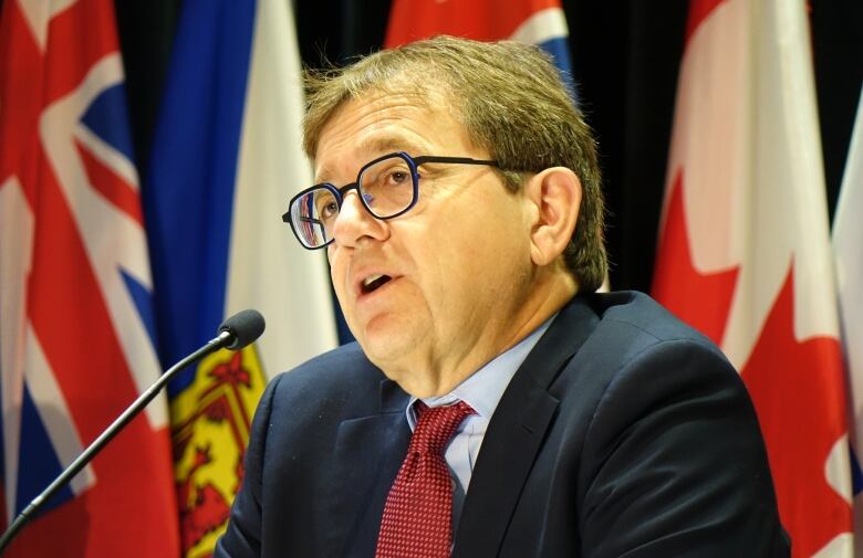 FederalNatural Resources Minister Jonathan Wilkinson speaking into a microphone during an industry conference in St. John's, N.L. 