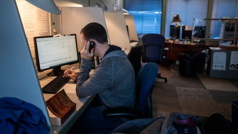 A volunteer takes a call at the Crisis Centre.