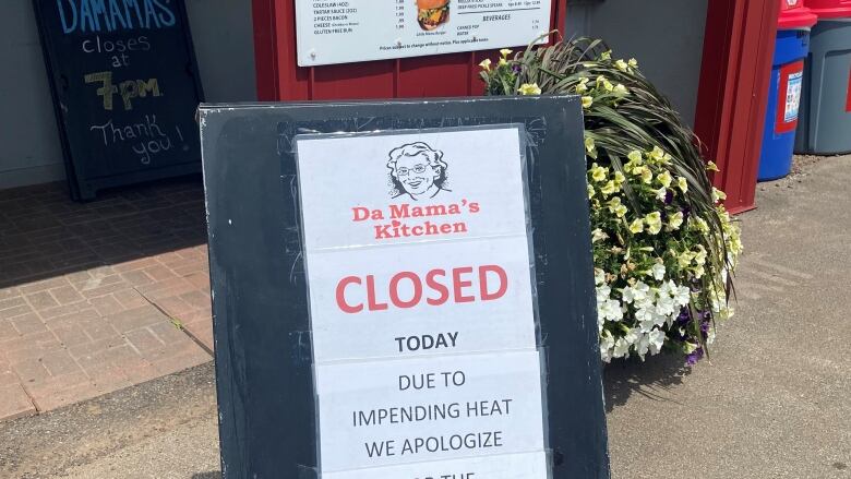 Sign showing restaurant closed due to heat