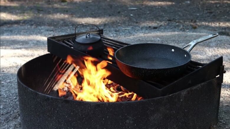 A fire burns in a fire pit in the N.W.T.