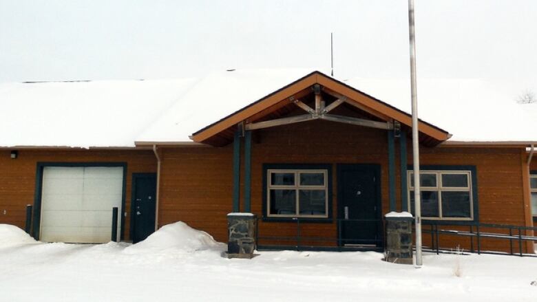 A building is pictured covered in snow.