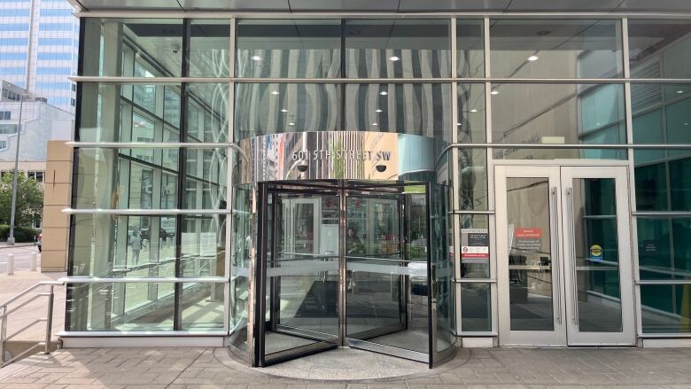 The front, spinning doors of the Calgary Courts Centre. 