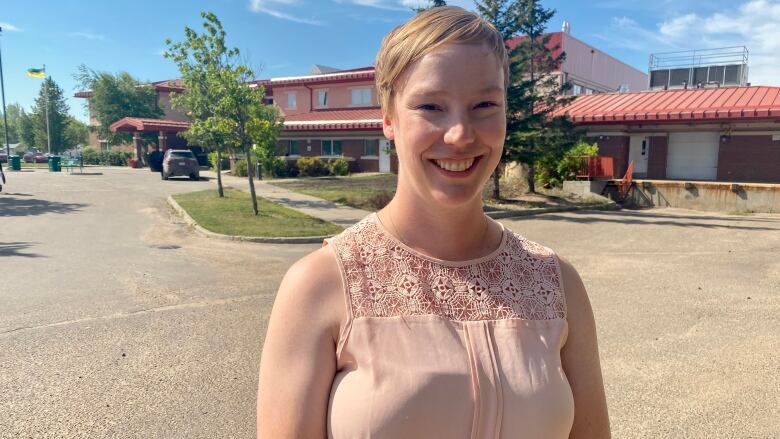 Kendal Carlberg stands in front of Meadow Lake Hospital in Meadow Lake, Sask. 