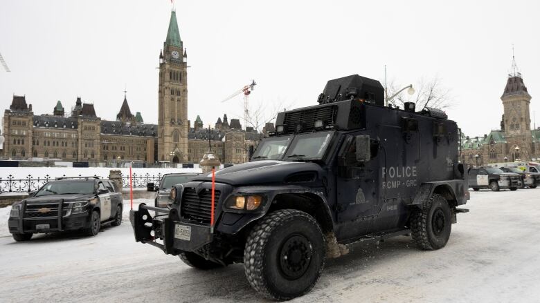 An RCMP tactical vehicle drives past the Parliament buildings, Sunday, Feb. 20, 2022 in Ottawa. 