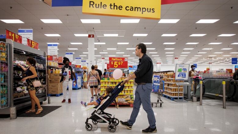 People shop in a Walmart store.