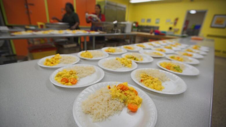 A plate with scrambled eggs and rice.