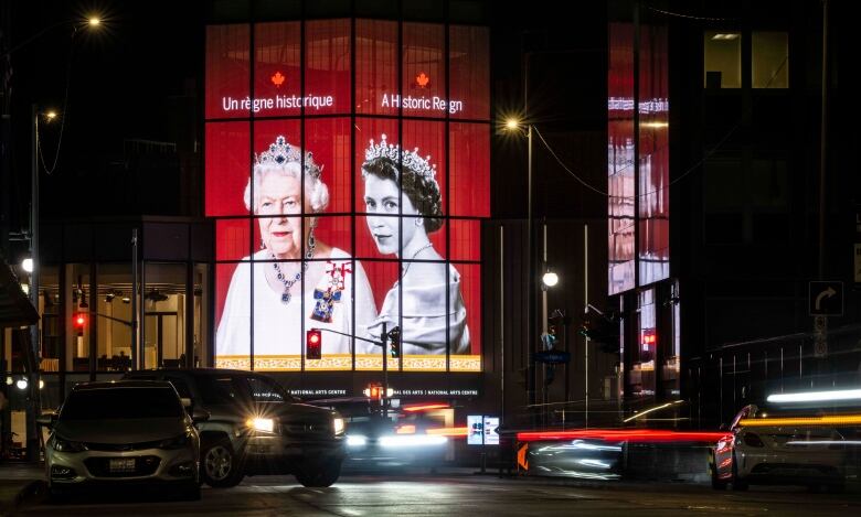 A tribute to Queen Elizabeth II is projected on the Kipnes Lantern of the National Arts Centre in Ottawa following her death on Thursday, Sept. 8, 2022.