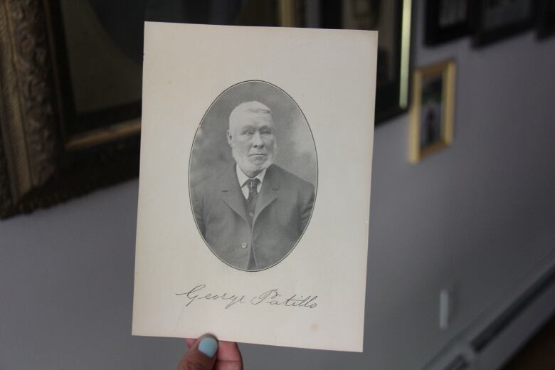 A black and white picture of a man in the 1860s wearing a suit