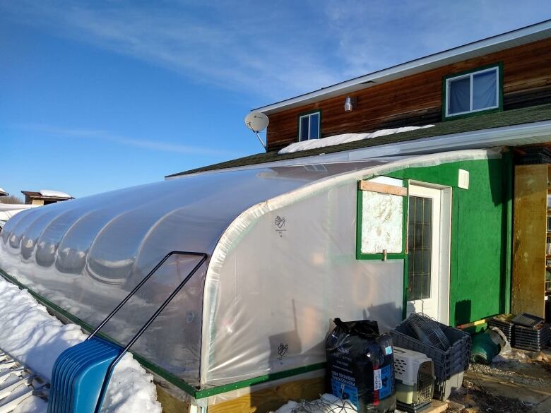 A greenhouse attached to a home.