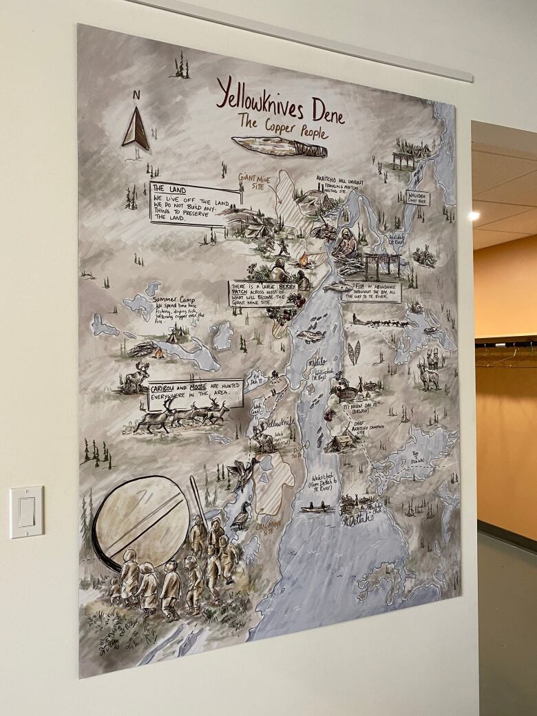 An illustrated map titled Yellowknives Dene: The Copper People hangs on a wall.