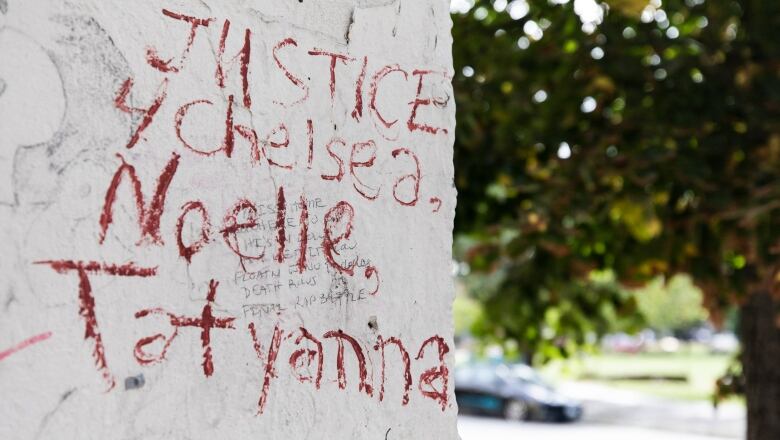 Scrawled graffiti that reads 'Justice 4 Chelsea, Nelle, Tatyanna'