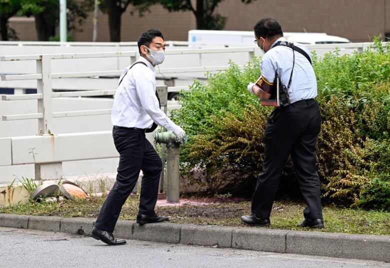 Police inspect a scene in Japan