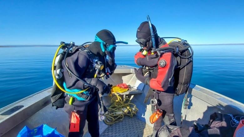 Divers on a boat.