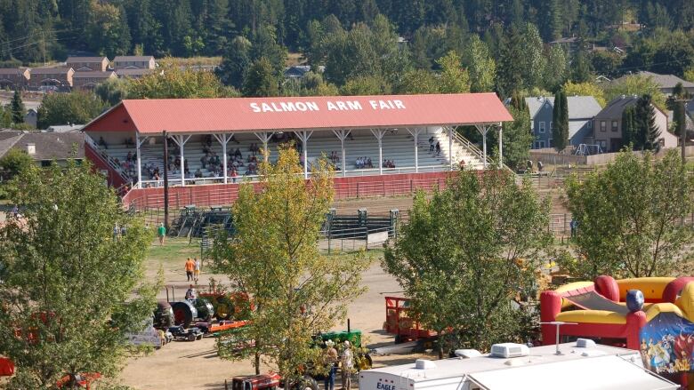 A pavilion that reads 'Salmon Arm Fair', with some floats visible in the foreground.