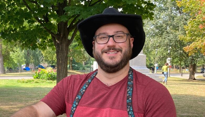 Portrait of a man in hat and glasses.