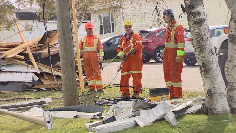 A restoration crew at work in Cornwall, P.E.I. Residents of the town should have their power back Tuesday.