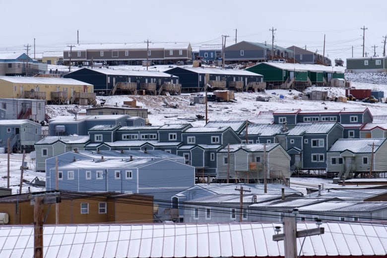 Multicoloured row housing on a slope. 