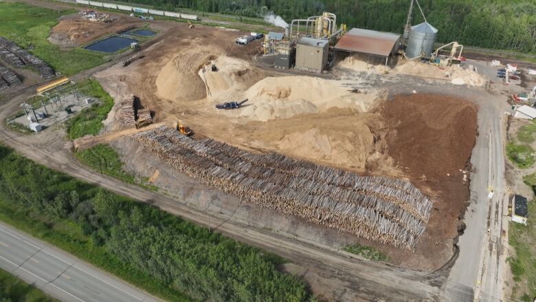 An aerial view shows thousands of logs piled up at the Meadowbank pellet plant near Prince George, B.C.