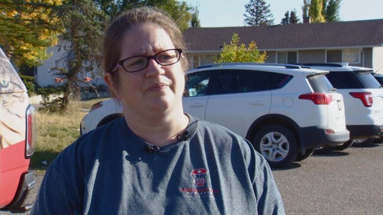 Jessica Doucette stands in a parking lot