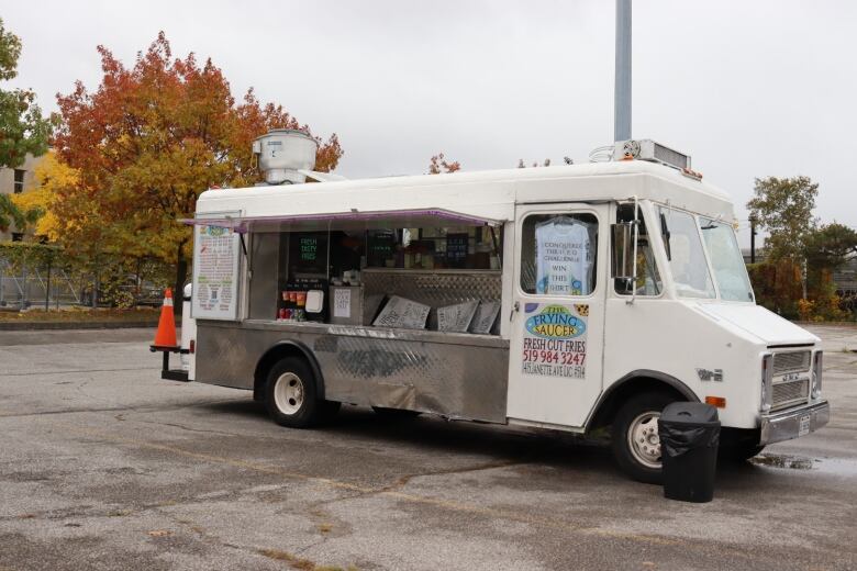 Food truck parked in a parking lot. 