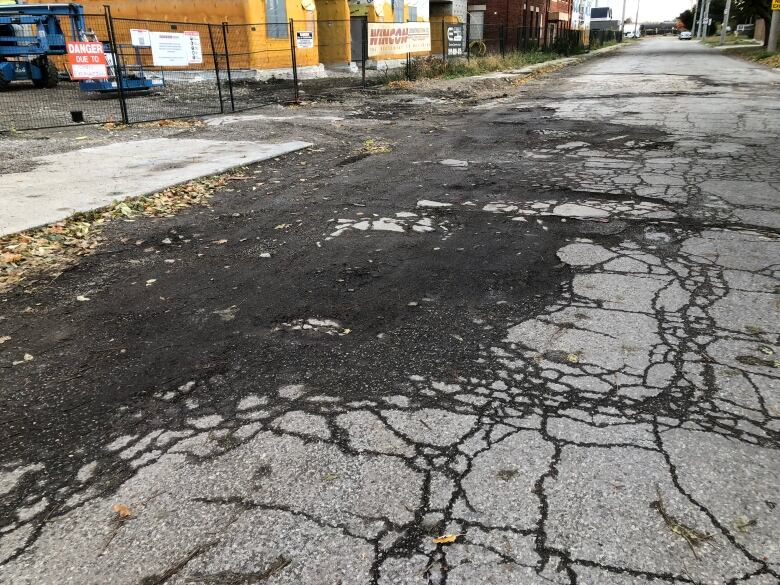 A large pothole in a road