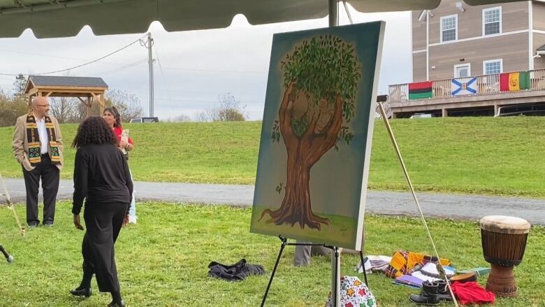 A painting of a tree made of two hands