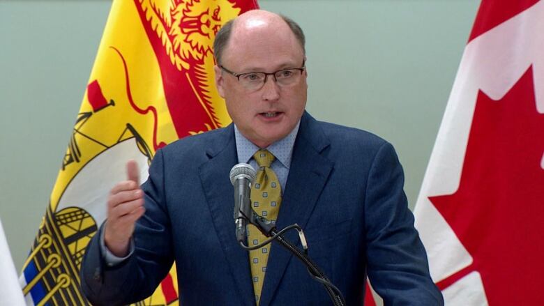 A man speaking into a microphone.